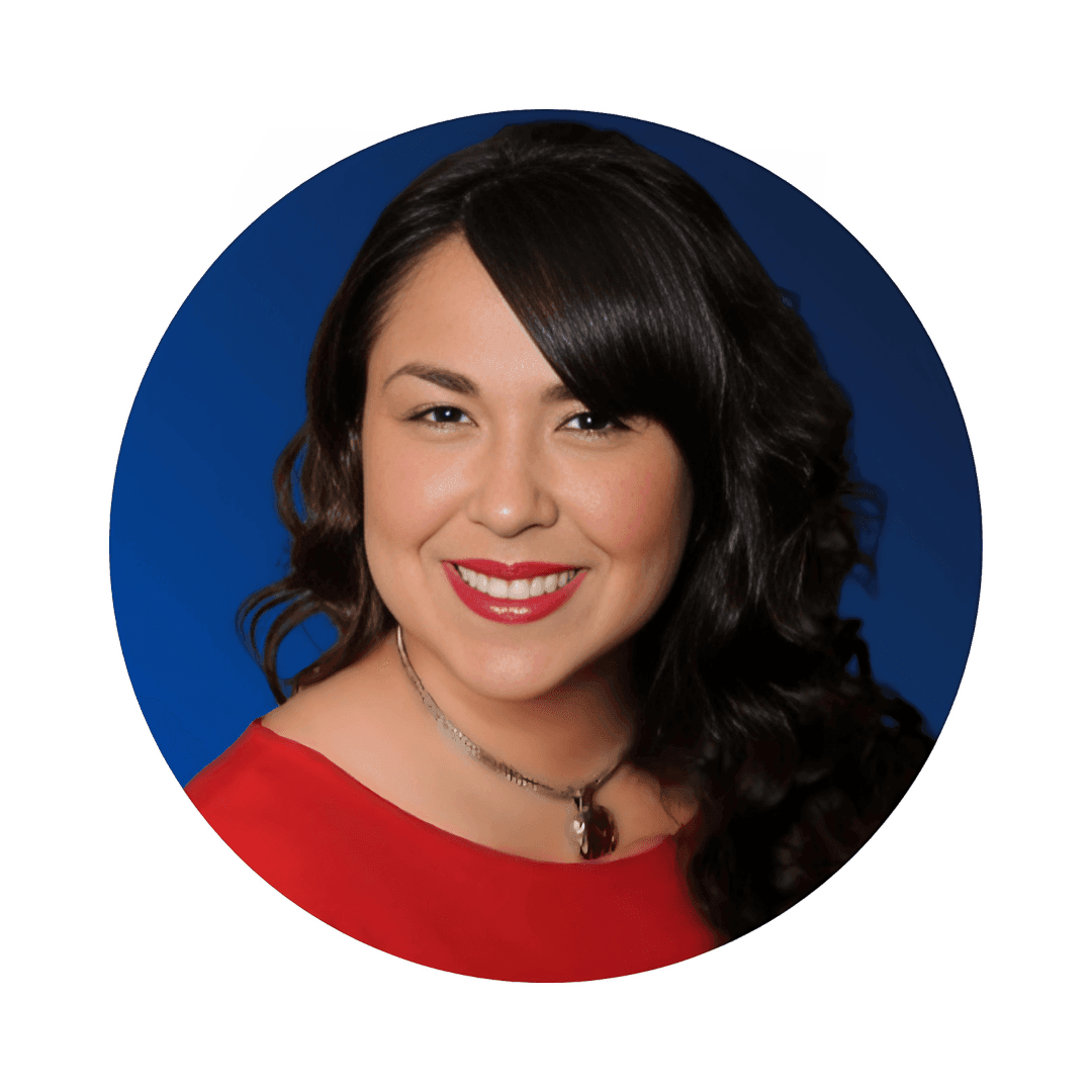 Smiling woman with long dark hair wearing a red top against a blue background.