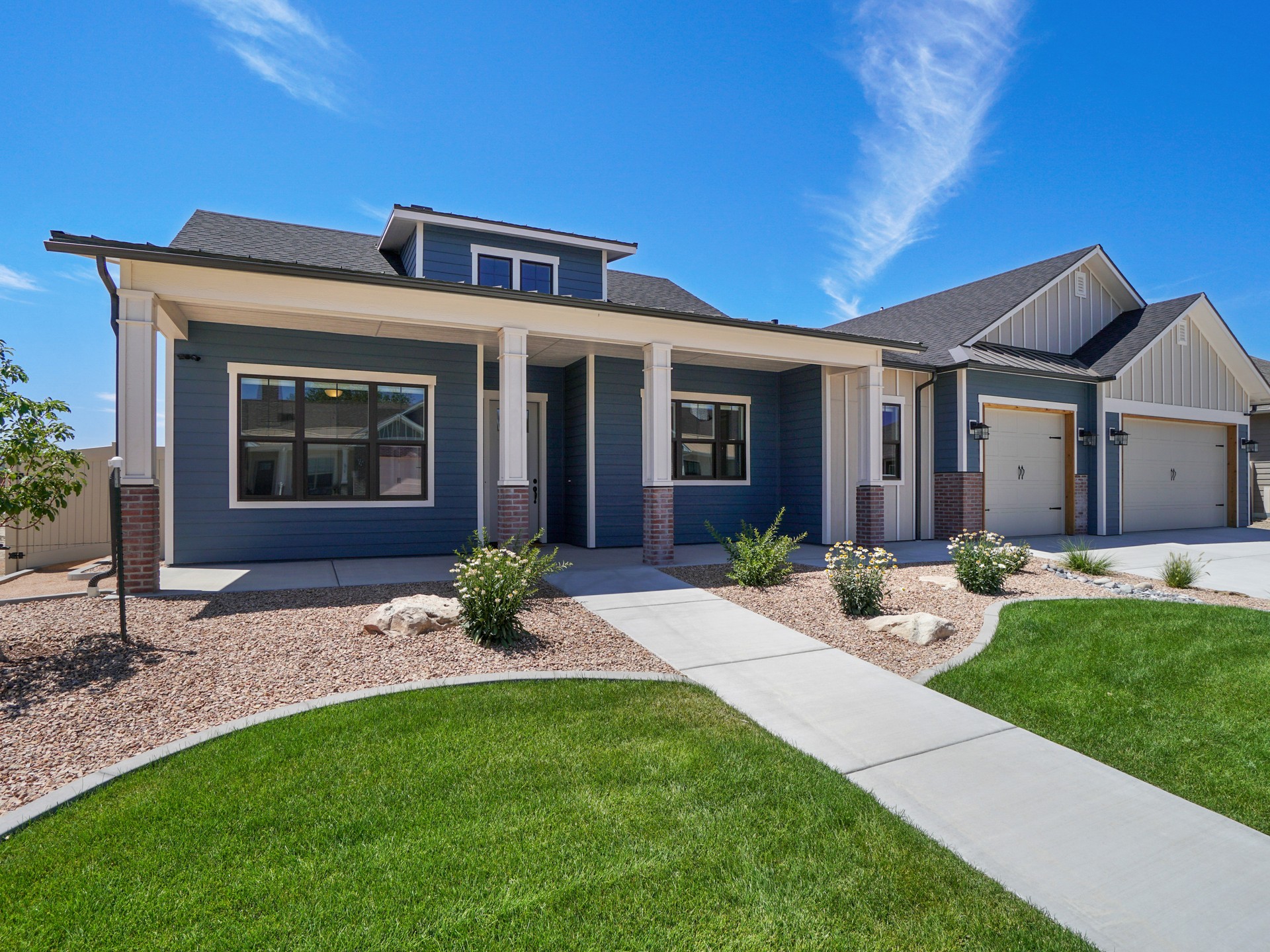 Modern Real Estate Front Exterior Blue and White Color Scheme with landscaping